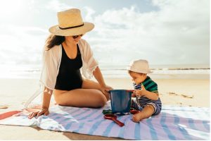 A person and baby on a beach